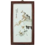 Chinese porcelain panel housed in a hardwood hanging frame, hand painted with a scholar's brush