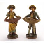 Pair of 19th century hand painted terracotta figural sweet meat dishes, impressed numbers to the