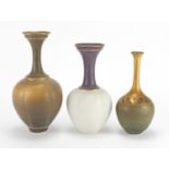 Three Bridget Drakeford Studio pottery vases, each hand gilded and with incised marks around the
