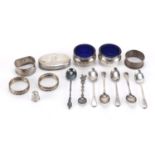 Silver items including three napkin rings, teaspoons and pair of open salts with blue glass