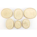 Six 19th century oval plaster plaques, each depicting classical scenes including one of David and