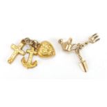 Two 9ct gold charms comprising Faith, Hope and Charity and a trowel, spade and watering can,