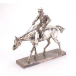 Large silver plated jockey on horseback, signed W Furick, impressed marks to the underside, 55cm