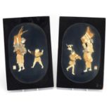 Pair of Japanese lacquered panels, each decorated with two figures, inlaid with ivory, bone and