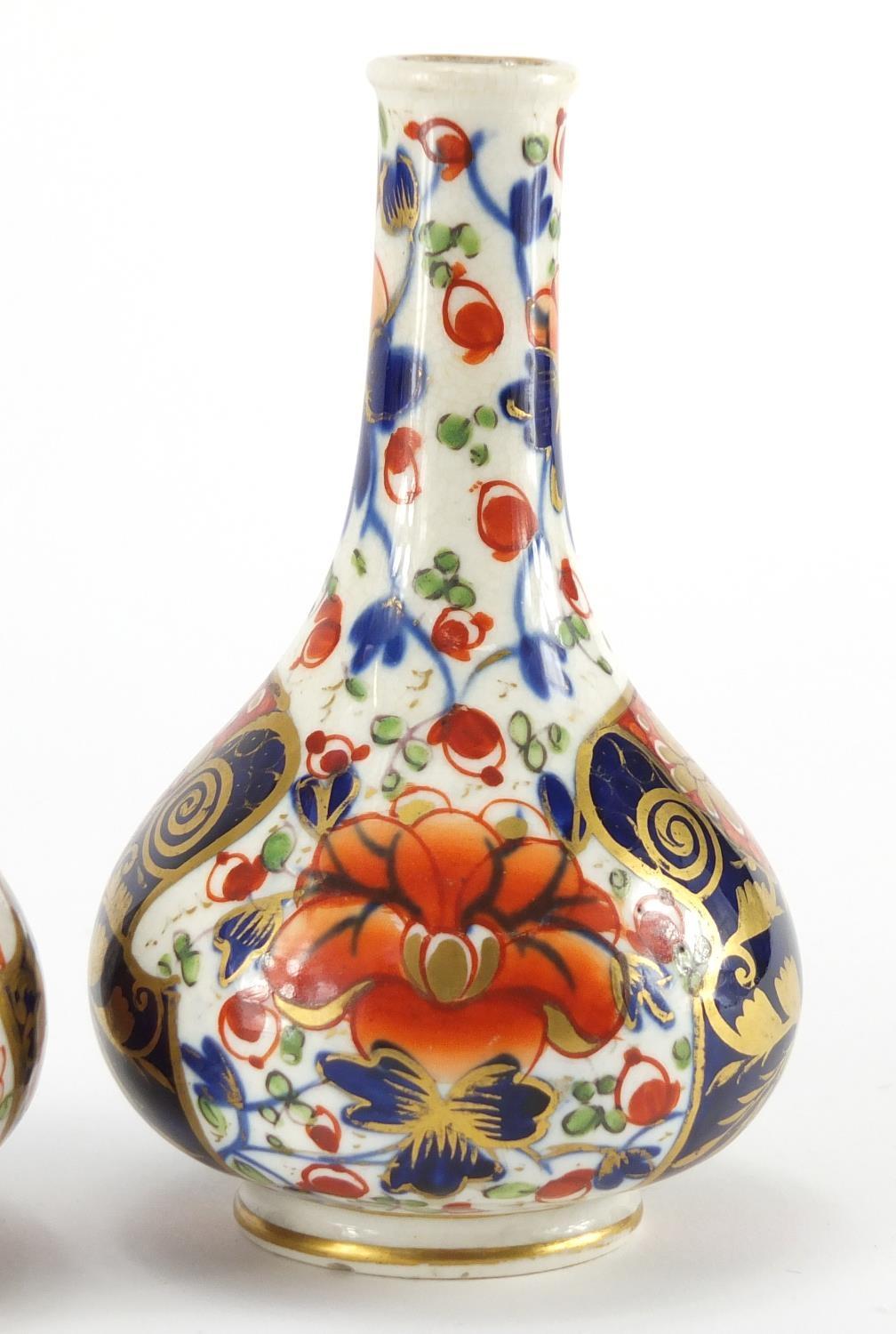 Two 19th century Derby porcelain bottle vases, hand painted and gilded in the Imari palette, painted - Image 3 of 7