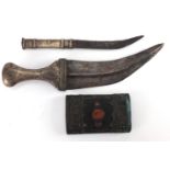 Two Islamic knives, each with unmarked silver coloured metal handles, the largest 30cm in length :
