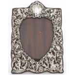 Victorian silver easel photo frame, embossed with maidens, cherubs and lions amongst flowers, by