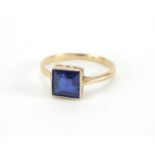 9ct gold blue stone ring, size K, approximate weight 1.9g, housed in a Hartung tooled leather box,