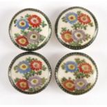 Four Japanese Satsuma pottery buttons, hand painted with flowers, each 2.5cm in diameter :For