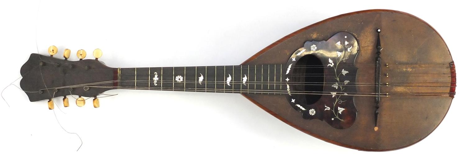 19th century rosewood mandolin with inlaid tortoiseshell guard and ivory pegs, bearing a Umberto