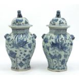 Large pair of Chinese blue and white porcelain vases and covers, with twin handles and octagonal