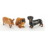Three Royal Doulton animals, Pekinese Dog HN1012, Dachshund HN1128 and Pig, the largest 15cm in