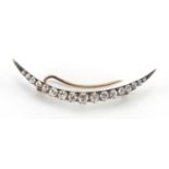 Unmarked white metal diamond moon cresent brooch, 5.5cm in length, approximate weight 5.3g :For