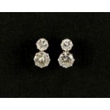 Pair of unmarked white metal diamond stud earrings, 9mm in length, approximate weight 1.8g, housed