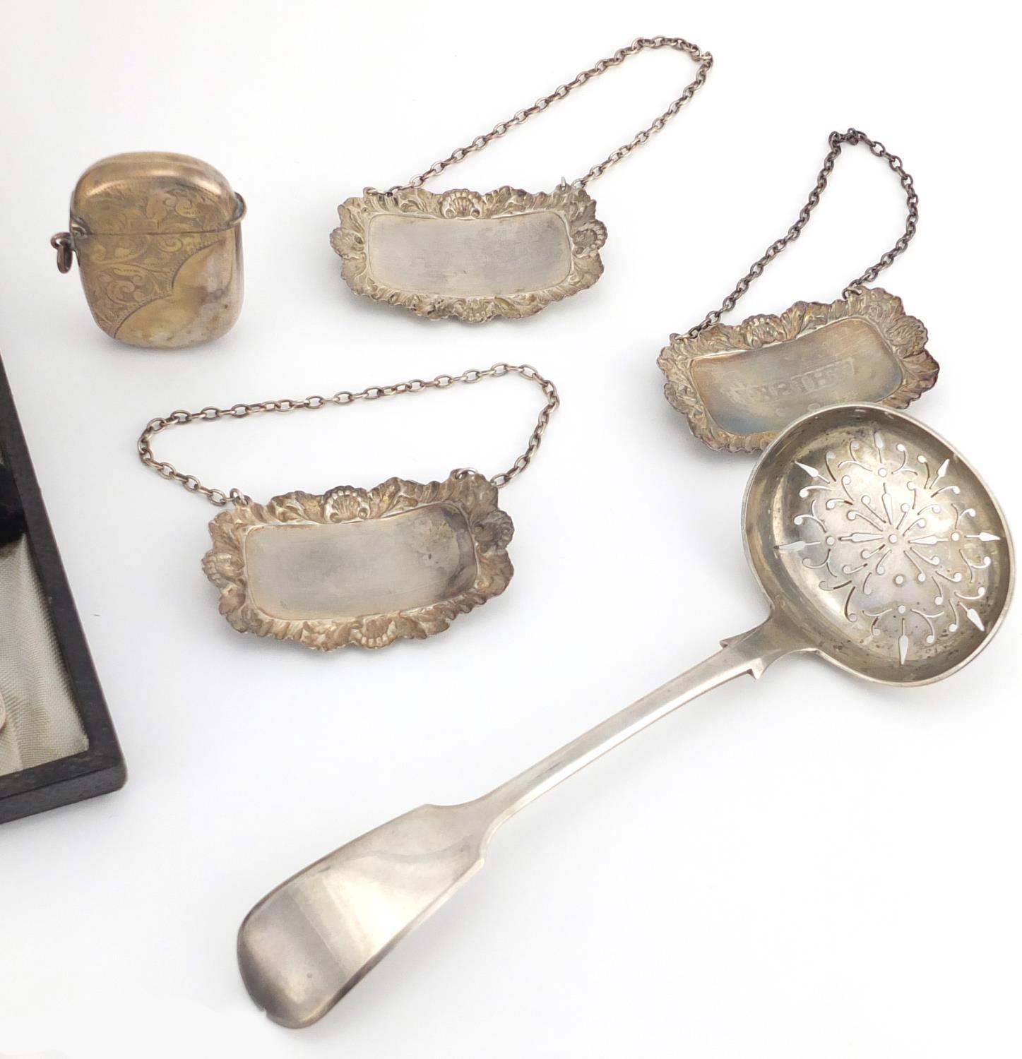 Silver items including a Victorian straining spoon, three decanter labels, a vesta and set of six - Image 6 of 6
