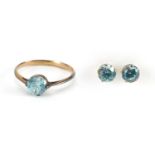 Unmarked gold blue stone solitaire ring and matching earrings, the ring size K, approximate weight