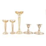 Two pairs of silver candlesticks and one other, various Birmingham and Sheffield hallmarks, the
