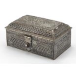 Rectangular Middle Eastern silver casket, pierced embossed with flowers, impressed marks and paper