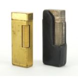 Two Dunhill pocket lighters included a silver plated example with leather case : For Further