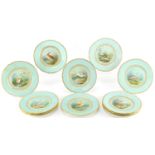 Set of twelve Victorian porcelain cabinet plates, each with a central enamelled and hand painted