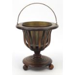 Regency style inlaid mahogany three footed planter with brass liner and swing handle, 40.5cm