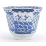 Chinese blue and white porcelain fluted tea bowl, hand painted with panels of birds and flowers,