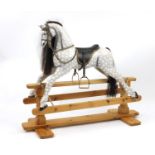 Hand painted carved wood rocking horse, on a pine base, with horse hair mane and tail, 107cm hair