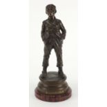 Halfdan Hertzberg - Siffleur, patinated bronze figure of a young, on circular red variegated