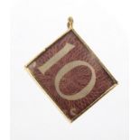 9ct gold emergency ten shilling not charm, 1.5cm in length, approximate weight 2.4g : For Further