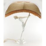 White glazed porcelain lamp and shade, in the form of a nude Art Deco female with out stretched