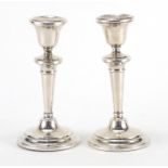 Pair of silver candlesticks of tapering form, hallmarked Birmingham 1919, 14cm high, approximate