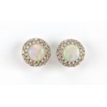 Pair of unmarked white metal cabochon opal and diamond stud earrings, 11mm in diameter,