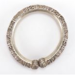 Chinese silver coloured metal bangle, pierced with foliate motifs, 9.5cm wide, approximate weight