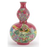 Chinese porcelain pink ground double gourd vase, hand painted in the famille rose palette with two