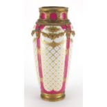 19th century Sèvres porcelain vase with gilt metal mounts, hand painted and gilded with flowers onto