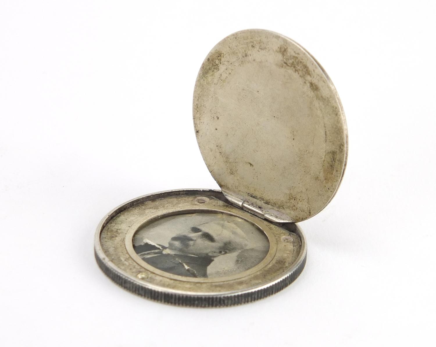 Novelty 19th century trade dollar secret coin locket, 4cm in diameter, approximate weight 21.8g :For