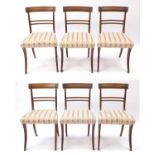 Set of six Regency mahogany dining chairs, with carved top rails and striped upholstered stuff