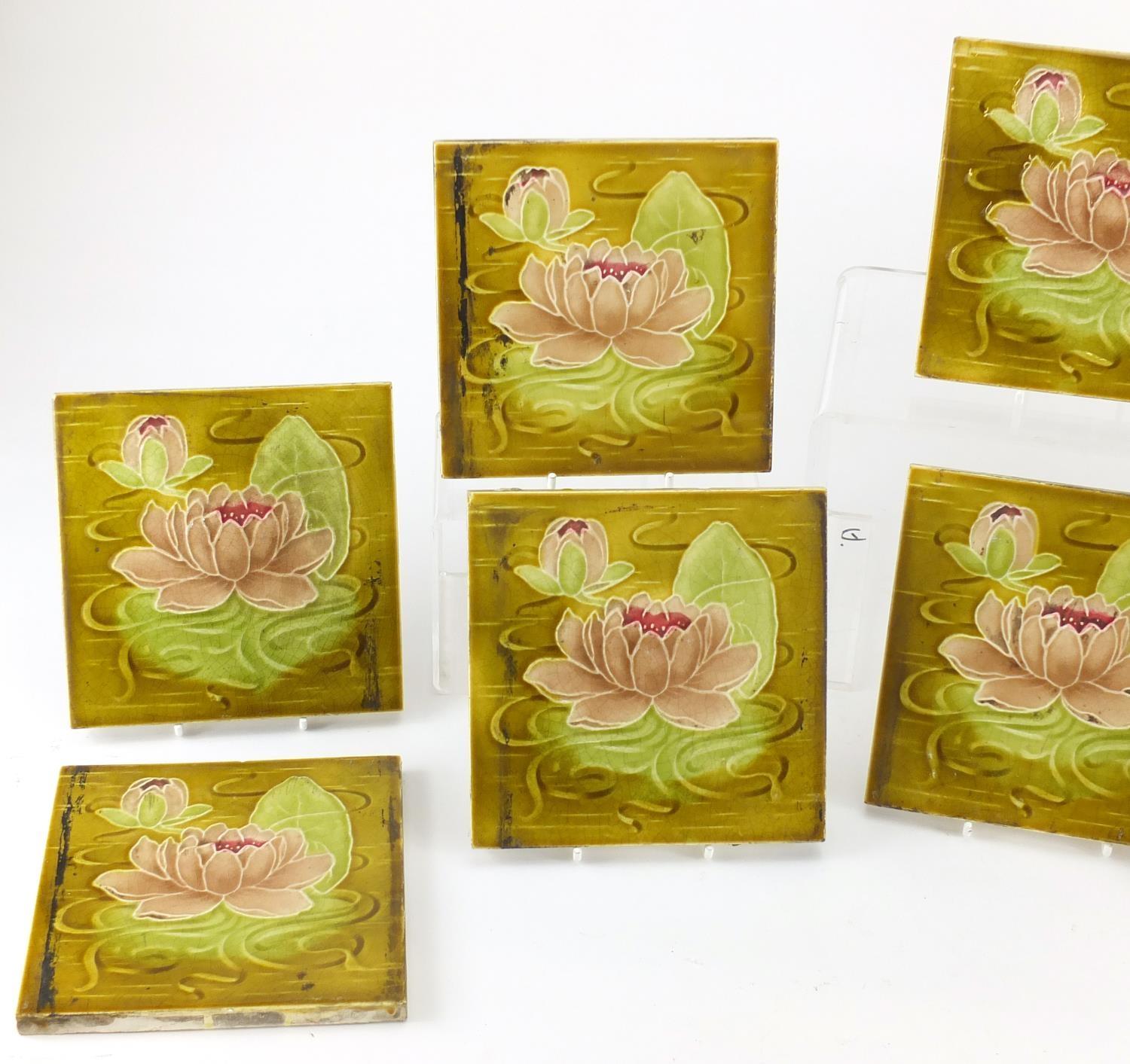 Ten Art Nouveau Maiolica tiles by Alfred Meakin, each hand painted with lily's, each 15.5cm x 15.5cm - Image 2 of 4