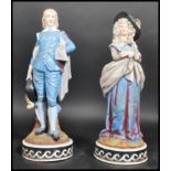 A pair of 19th century Meissen porcelain figurines. One modelled as a lady, the other a dandy