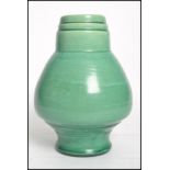 A Charles Hubert Brannam Barnstable Ltd pottery vase of bulbous form having a bulbous body with