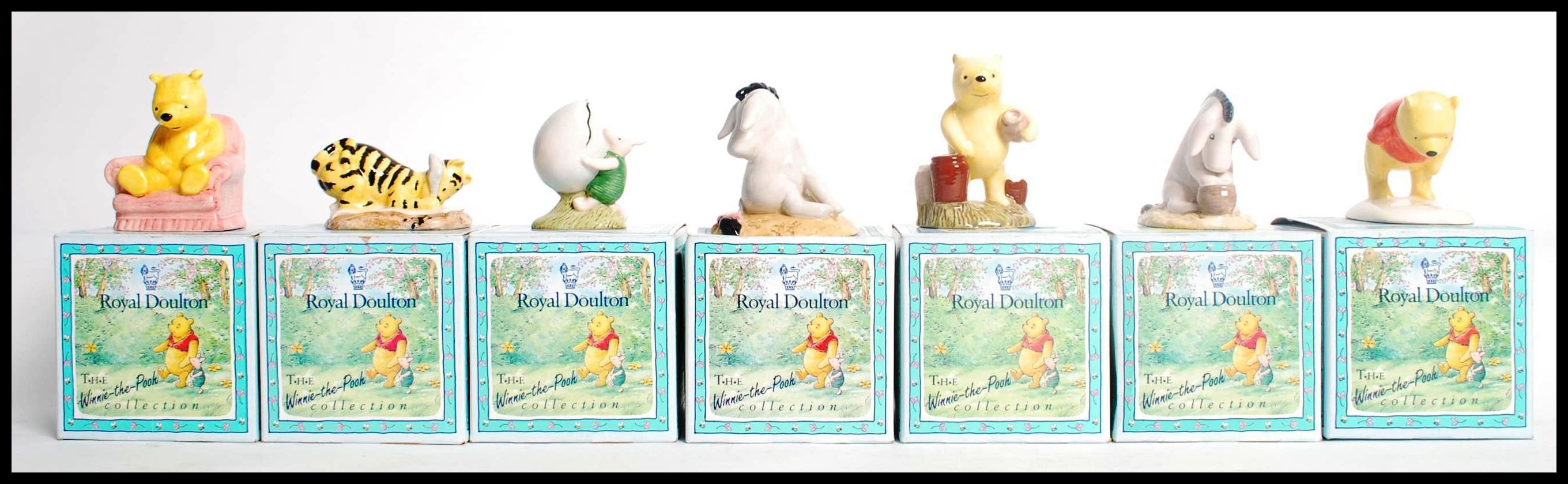 A group of seven Royal Doulton The Winnie The Pooh Collection boxed figurines to include, WP4 Pooh