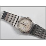 An Omega Constellation gentleman's wristwatch ( watch )  having  a silvered circular dial with