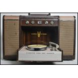 A vintage 20th century Crown V Stereo mobile 12 Transistor stereo radio phonograph. Measures 42.