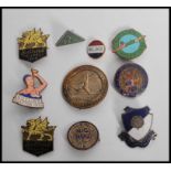 A collection of vintage 20th century enamel badges to include Butlins Clacton 1939, Butlins,