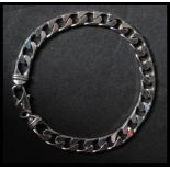 A 9ct white gold Italian curb link bracelet with lobster claw clasp. Marked A1 Star 375. Measures