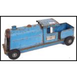 A vintage mid century Triang Express tin plate train in blue colourway with original makers plaque