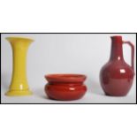 A group of three early 20th century Arts and Crafts pieces of pottery to include an unusual