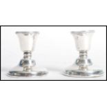 A pair of silver stub hallmarked silver candlesticks having hallmarks for Birmingham, date letter