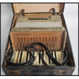 A vintage 20th century Alvari accordion musical instrument complete in original case. Case measures: