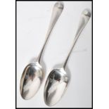 A pair of mid 18th century George II silver hallmarked table spoons by Ebenezer Coker having